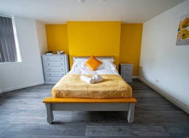 Clarence Retreat bedroom yellow wall