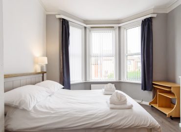 Handpost Lodge bedroom with view